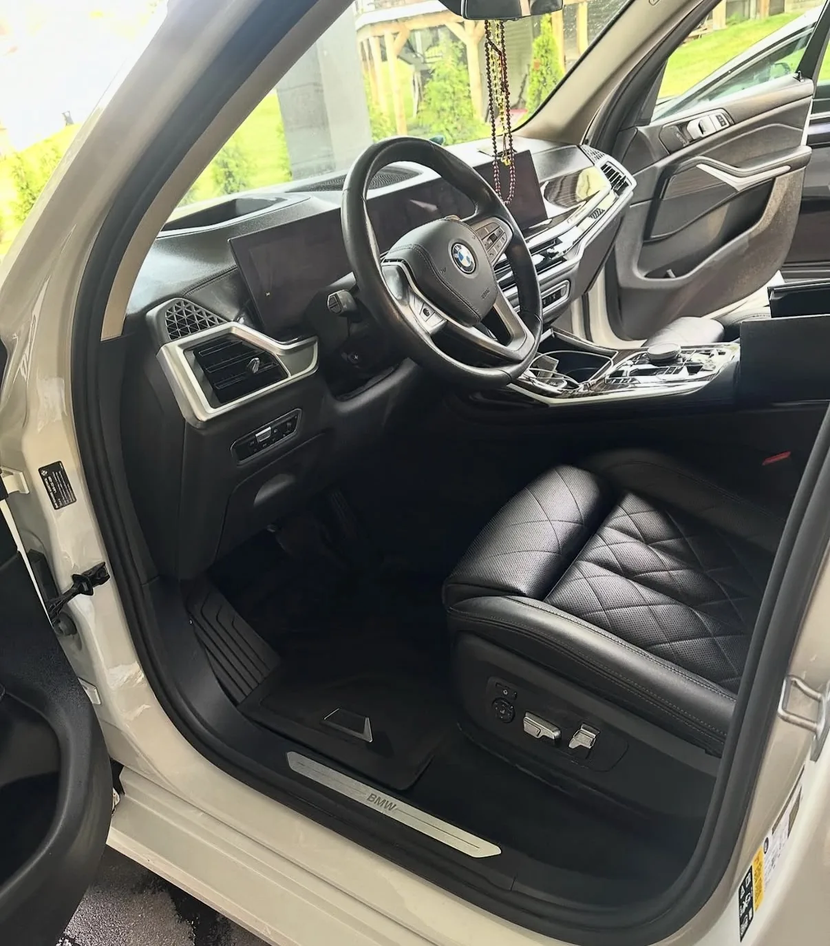 BMW interior after mobile detailing with clean floor and cabin