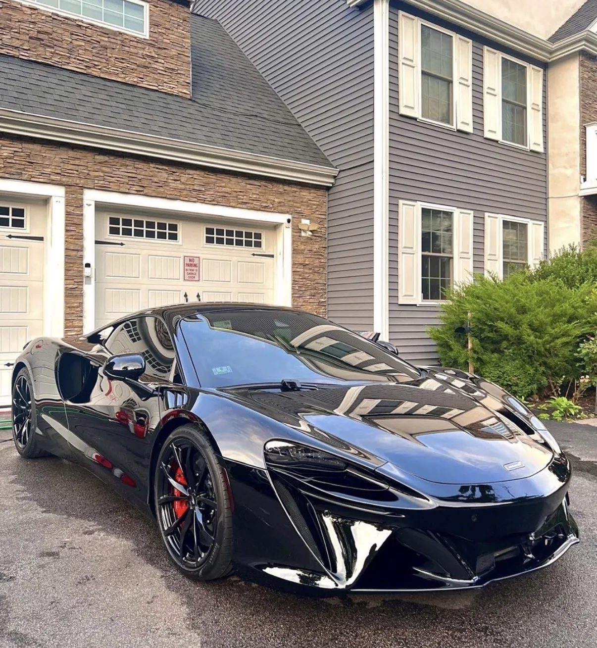 Glossy black McLaren after mobile detailing