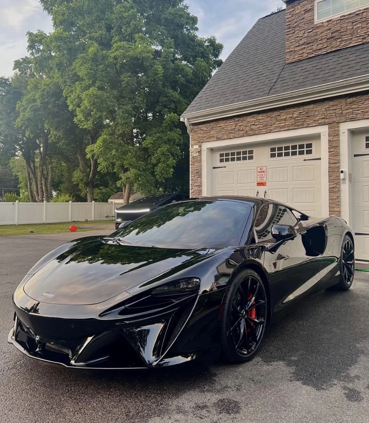 Black McLaren with glossy finish after detailing